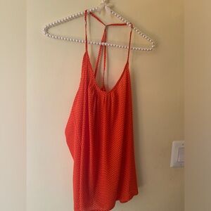 Orange tank with small white polka dots